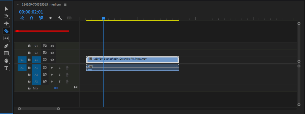 Premiere Pro's Timeline window, highlighting where to select the Razor Tool.