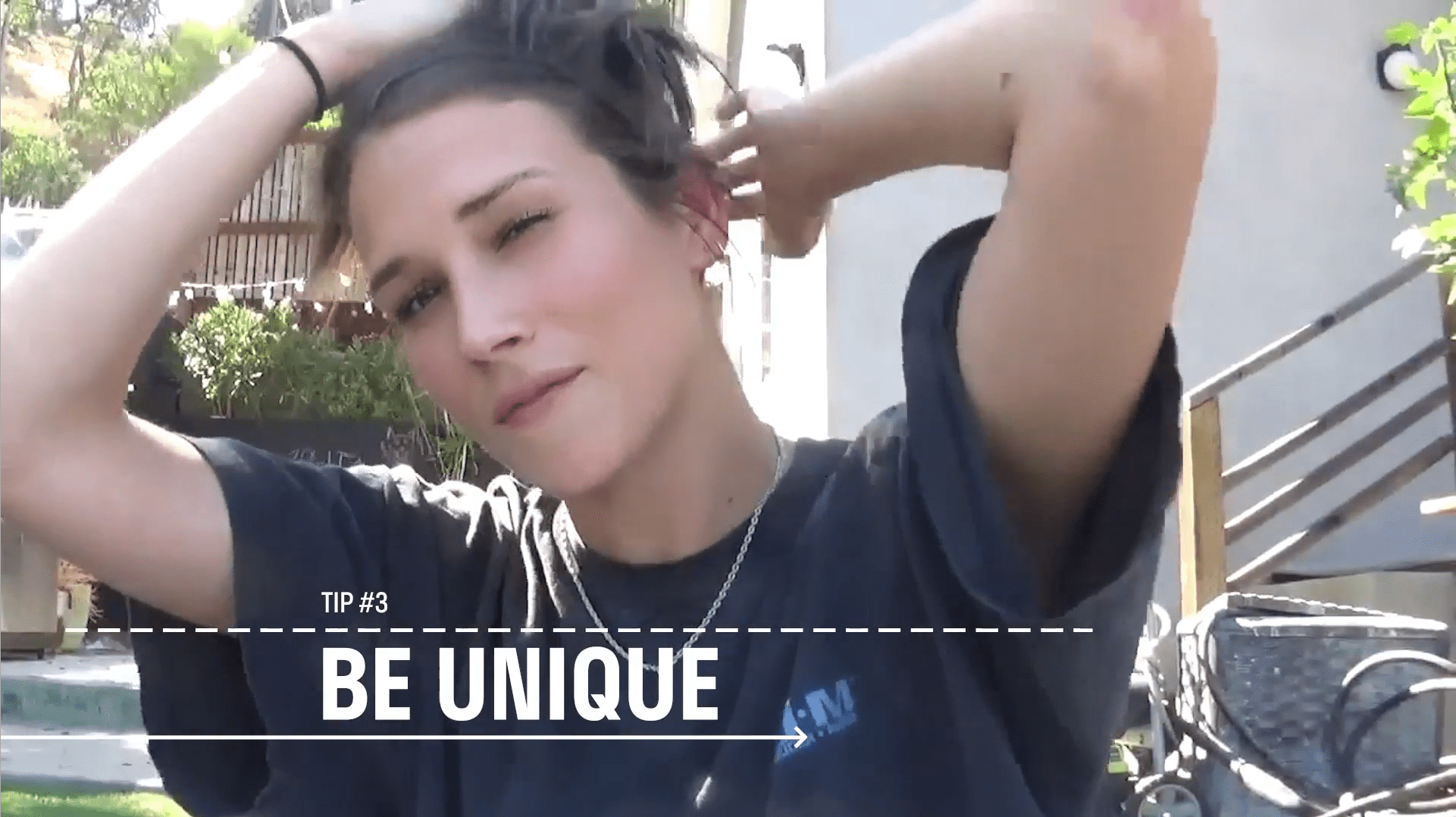 Image of Shannon Beveridge holding her hair up with her hand on her head with white text that reads Tip #3 - Be unique to create videos that engage audiences. 