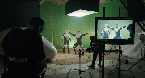 two actors in front of green screen