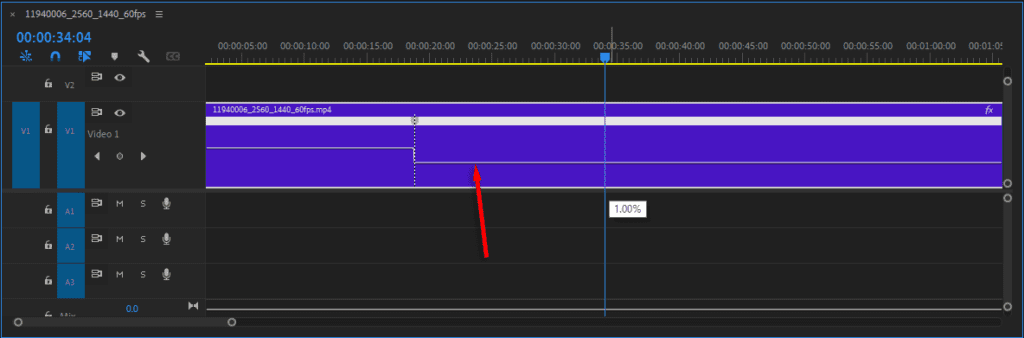 A screenshot of the Timeline in Premiere Pro after dragging down the "rubber band" to slow time in the selected segment of the clip.