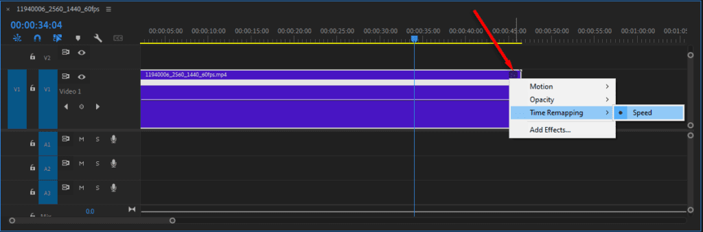 A screenshot of Premiere Pro's Timeline window showing how to right-click the FX icon and select Time Remapping > Speed.