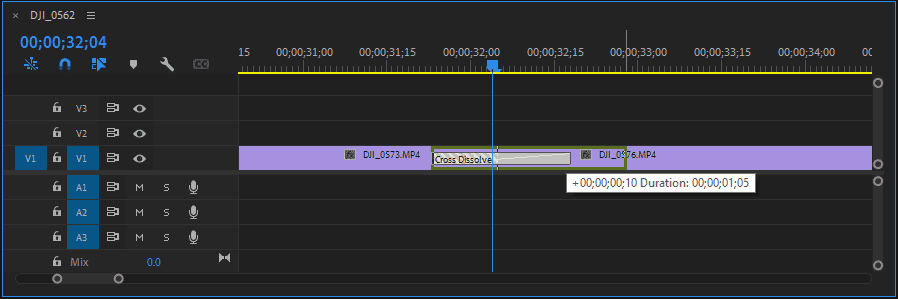 A screenshot of the Premiere Pro Timeline showing how to extend a transition by clicking and dragging from its edge.