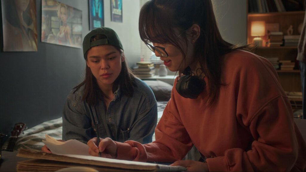 Two women reviewing a video shot list for an upcoming shoot
