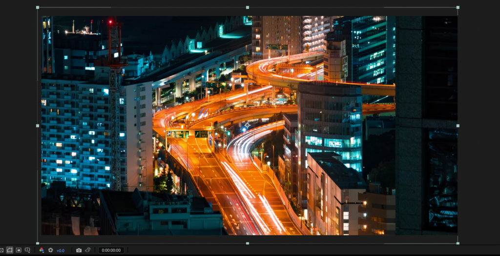 Screenshot showing a footage clip in After Effects of a city highway scene at night