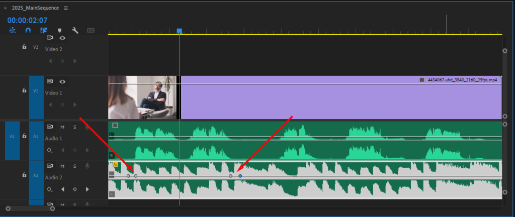 Premiere Pro's Timeline, showing the music layer with four new keyframes added to either side of the dialogue.