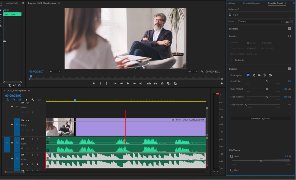  A screenshot of Premiere Pro's timeline showing the automatically ducked music layer.