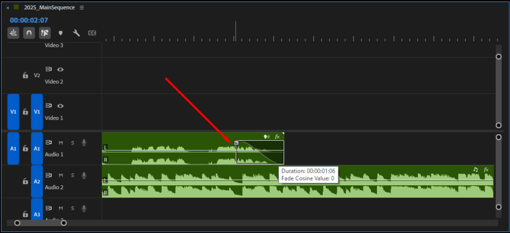 Premiere Pro's Timeline, showing what it looks like to drag the fade handle inwards and create a fade out.